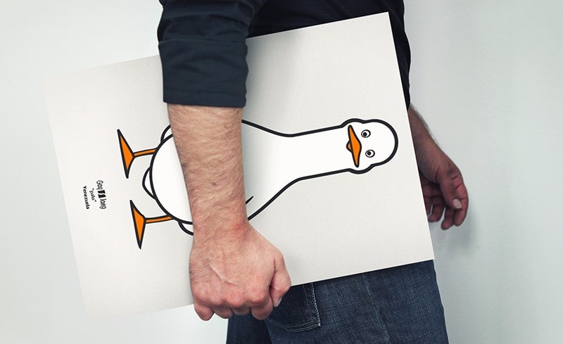 Pato | Gay Dictionary, Latin America Photograph in short shot of a boy carrying a poster with Pato drawing.