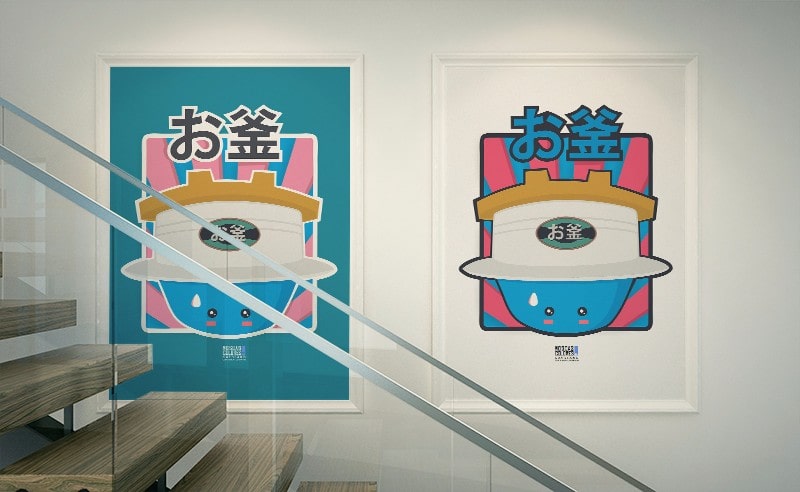 Photograph of two framed posters with the Okama illustrations.