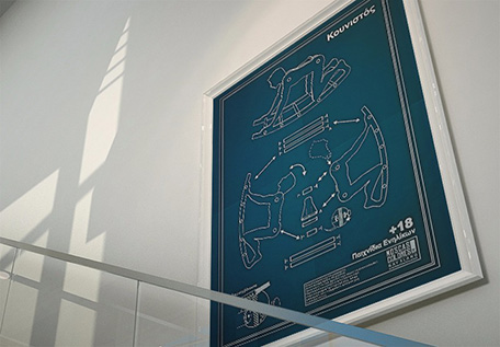 Nace o se hace ?Poster en la pared de una escalera, con la ilustración Kunistós, consistente en los planos para construir un balancín.