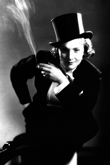 Kesser Vater, Marlene Dietrich. Morocco. Photo of Marlene Dietrich dressed as a man and smoking, like a Kesser Vater. Black and white photo.
